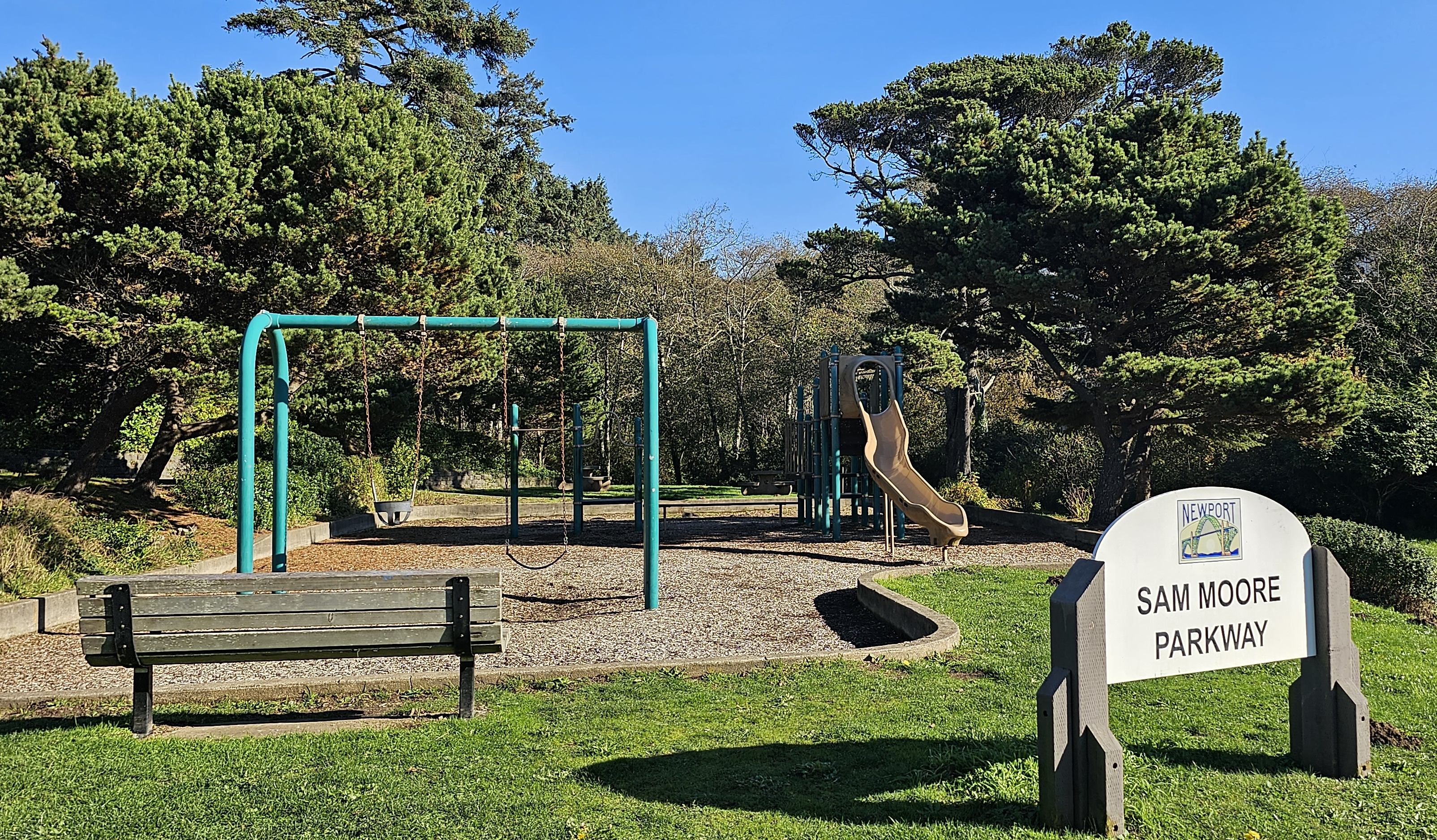playground with swimgs and slide